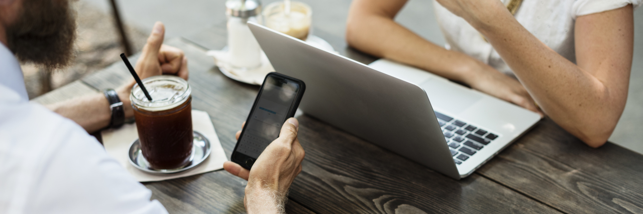 Useful Apps to Help Support Your Mental Health business people at coffee shop with smartphones