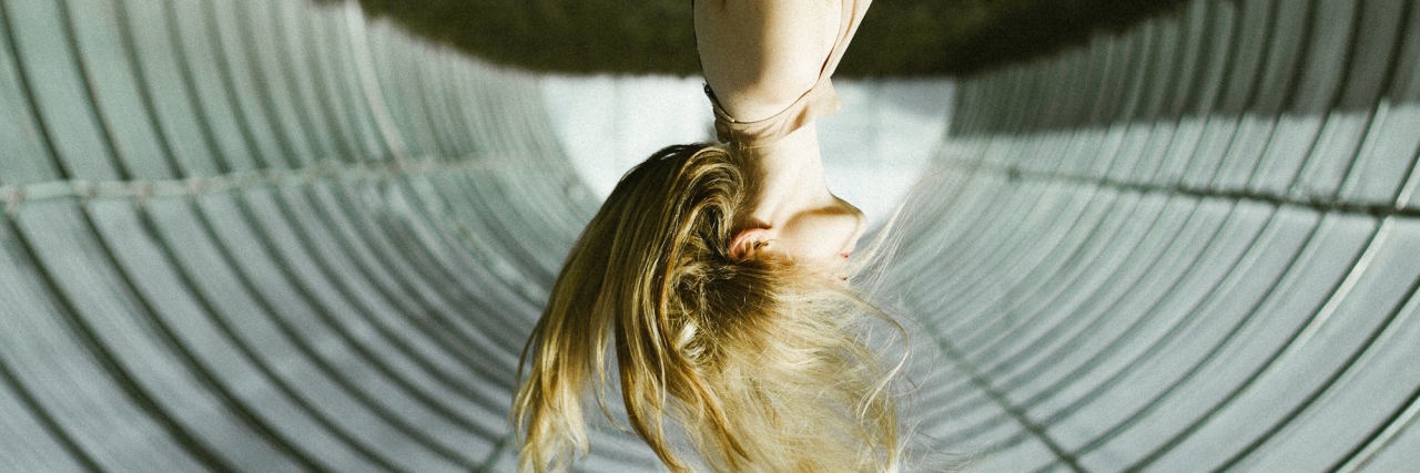 Read This If You Feel Like Suicide Is a 'Solution' to Your Pain woman upside down