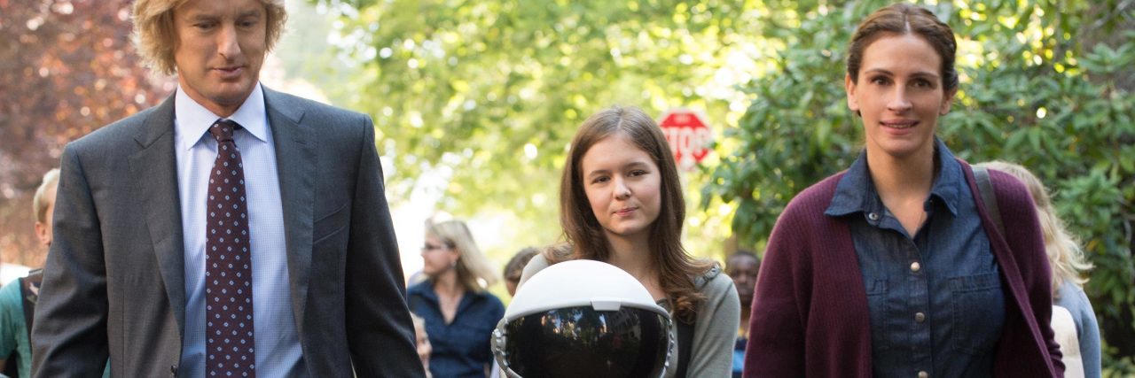 Watching Wonder as Someone With a Craniofacial Disorder Julia Roberts and Owen Wilson holding the hand of Auggie from the film "Wonder"