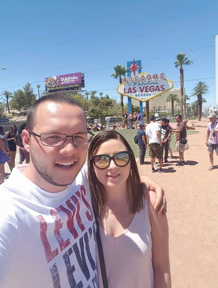 man and woman standing outside wearing sunglasses in las vegas