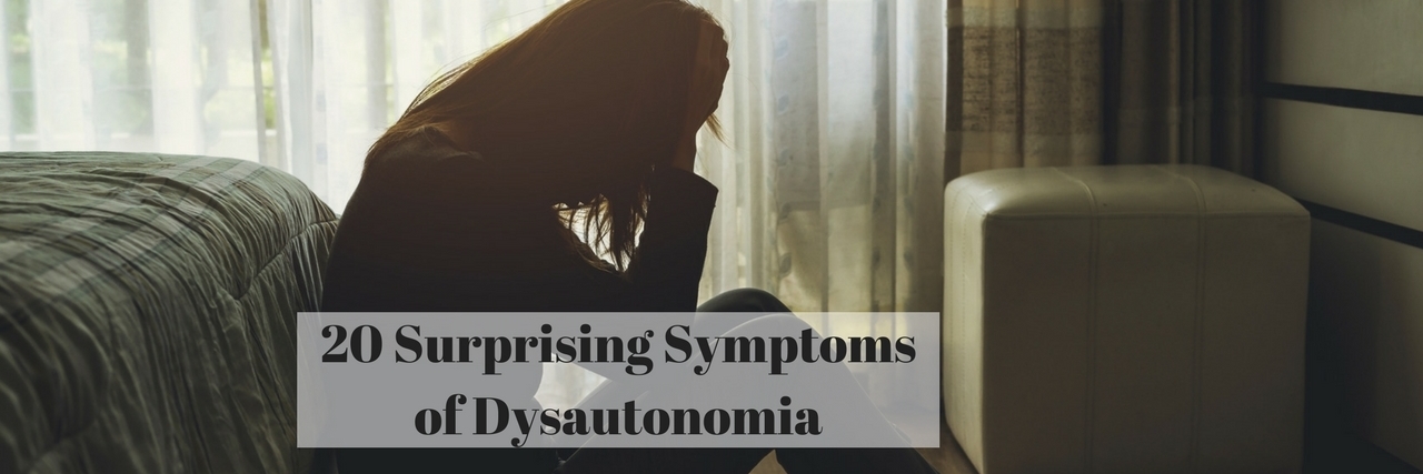 20 Surprising Symptoms of Dysautonomia text over photo of woman sitting on floor next to bed holding her head