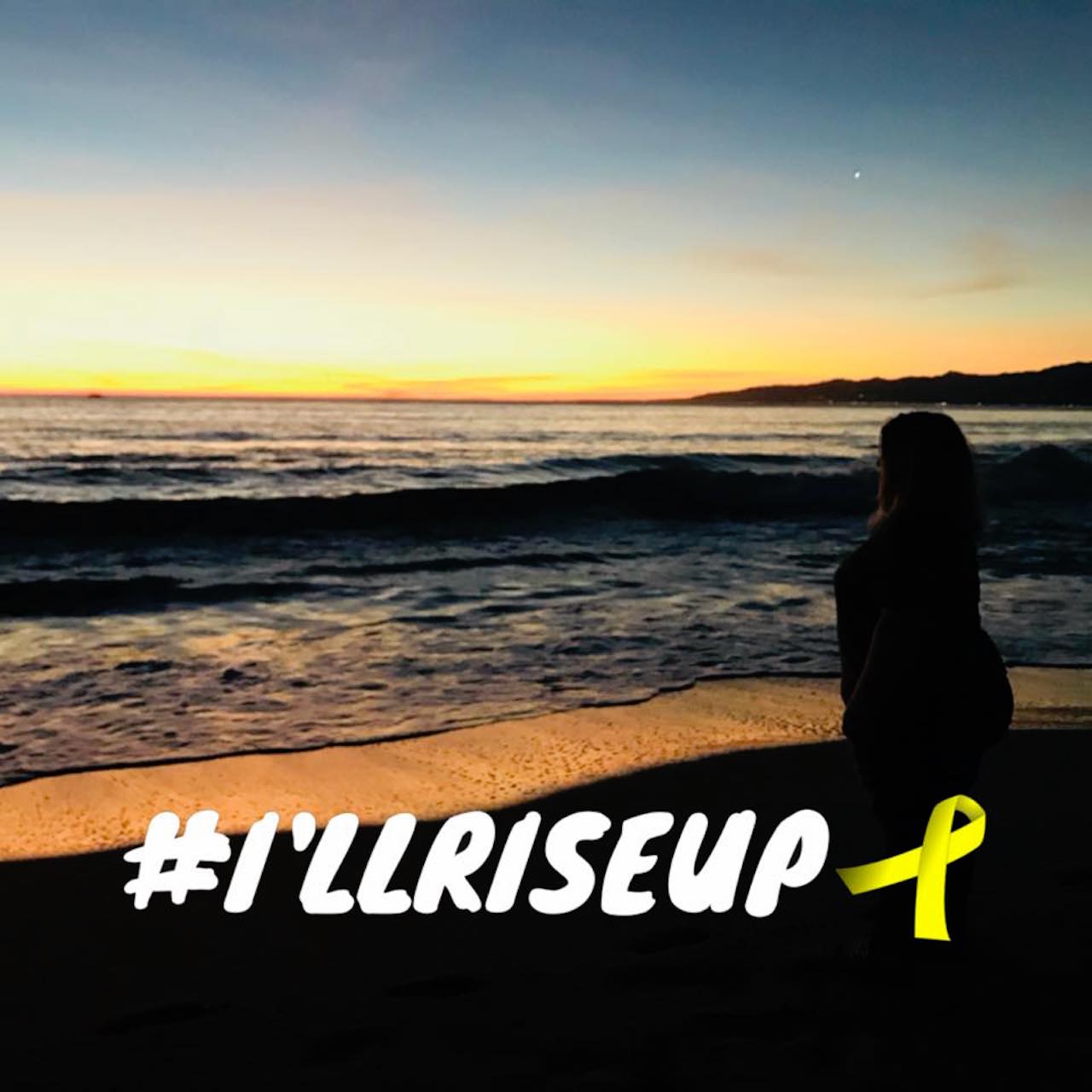 woman standing on the beach at sunset with the hashtag "I'll rise up"