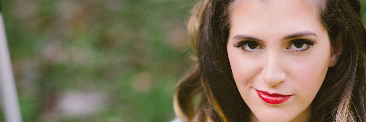 Books on Managing Chronic and Rare Illness Ilana Jacqueline ilana smilling in a patient gown and hospital bracelet