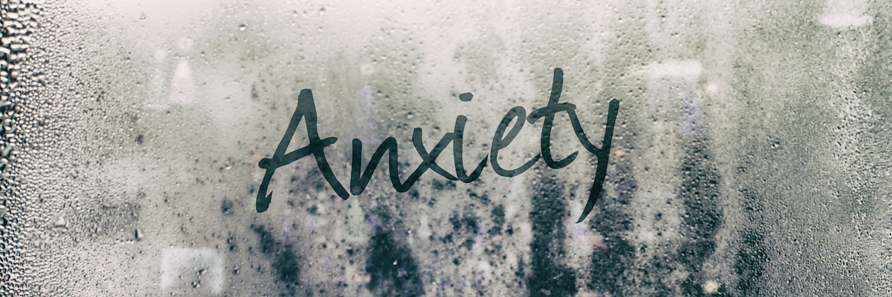 Anxiety written on a foggy mirror