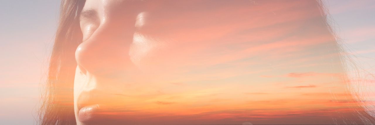 The Thought That Changed My Whole Approach to Eating Disorder Recovery Double exposure portrait of a girl with ginger drealocks combined with photograph of sunset