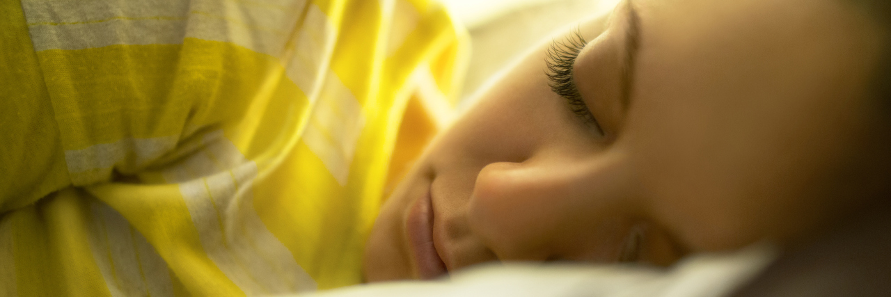 I Can't Work Because of My Illness, but I'm Still Valuable A woman laying in her bed.