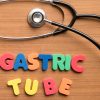 Nasogastric tube colorful word with stethoscope on the wooden background