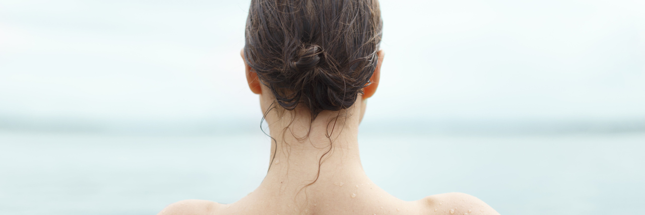 Having Hope After Contemplating Suicide With Ehlers-Danlos Syndrome photo of back of woman swimming in the ocean with wet hair