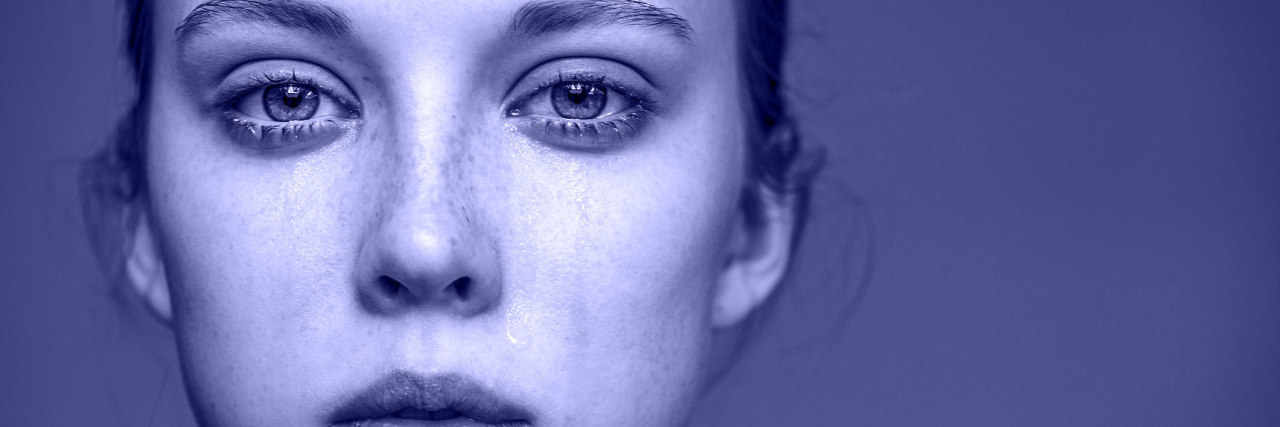 When You Can't Just 'Cut Out' Emotionally Abusive Parents From Life beautiful young girl crying indoor