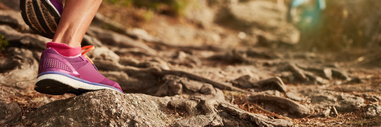 How Facing Chiari Malformation Is Like the Race of a Lifetime Close up of an athlete's feet wearing sports shoes on a challenging dirt track