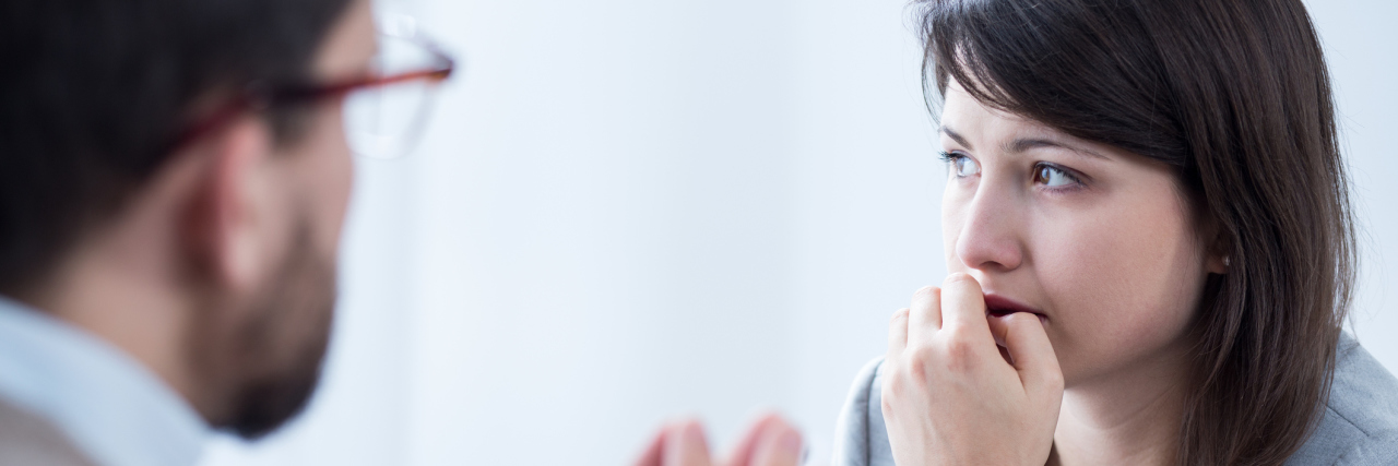 When a Therapist Told Me I Had 'Given Up' Because of My Fibromyalgia A woman talking to a therapist.