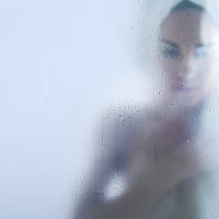 woman crying in shower