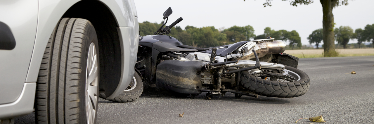 Leg Amputation After a Motorcycle Accident Motorbike accident on the road with a car.