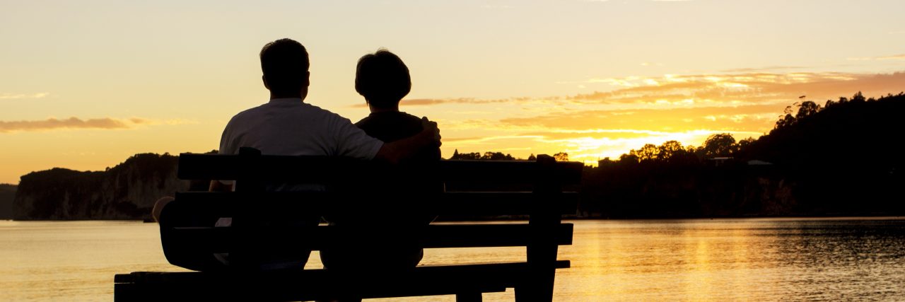Marriage and Complex Regional Pain Syndrome Couple watching a beautiful sunset together.