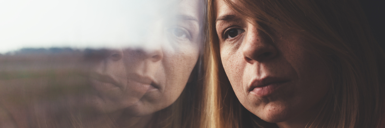 When Anxiety and Depression Make You Feel Stuck Outside of Your Life A woman in train alone and sad