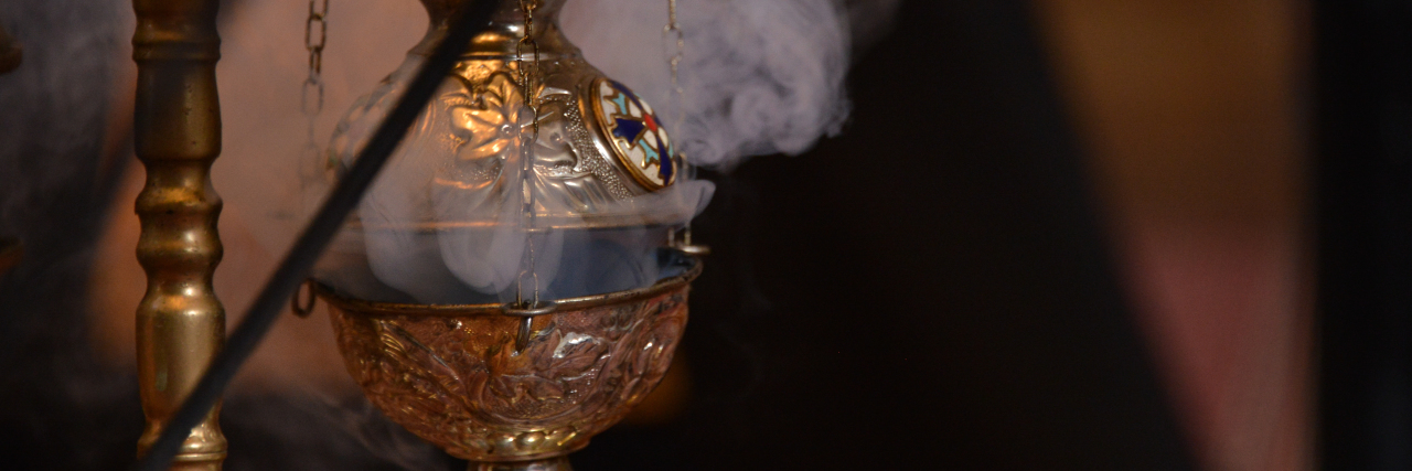 Autistic and Eastern Orthodox Smoke from incense at Christian church.