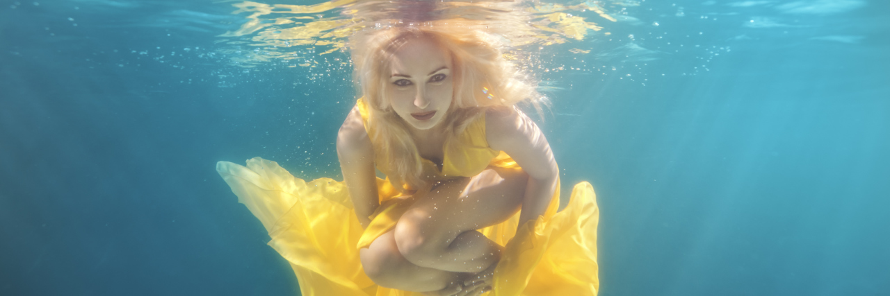 Woman underwater.