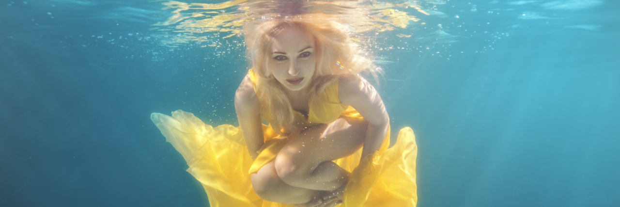 Accepting My Life With Cerebral Palsy Woman underwater.