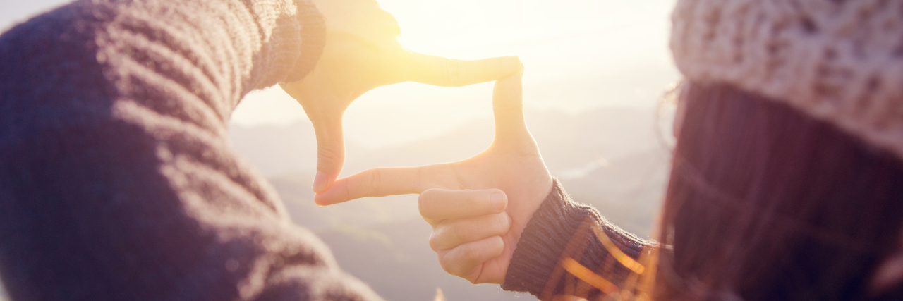When Your Illness Changes Your Dreams A woman looking at a sunset, visualizing.