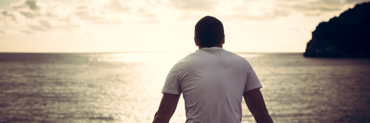 If I Didn't Stutter Man looking at the ocean and horizon.