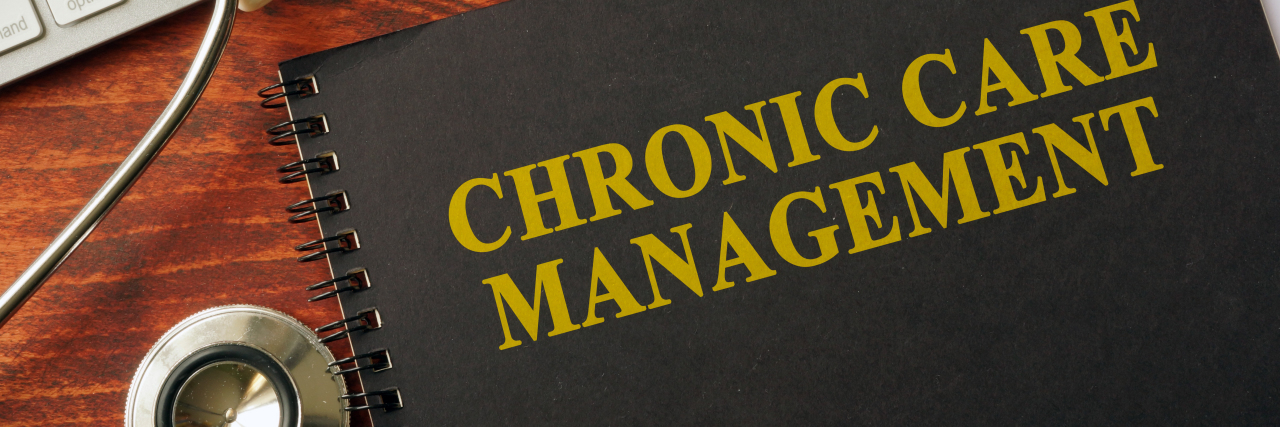 Advice for Managing a Chronic and Rare Illness Book with title chronic care management on a table. Pain management concept.