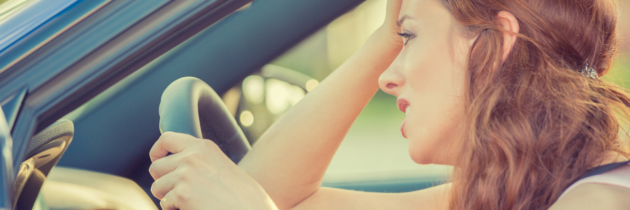 Finding Treatment for My Unexpected Panic Attacks side view of stressed panicked woman driving car
