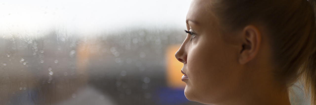 Having a Child After Losing a Baby Thoughtful woman looking out the window