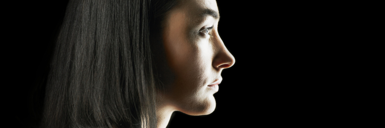 profile portrait of a woman with dark hair