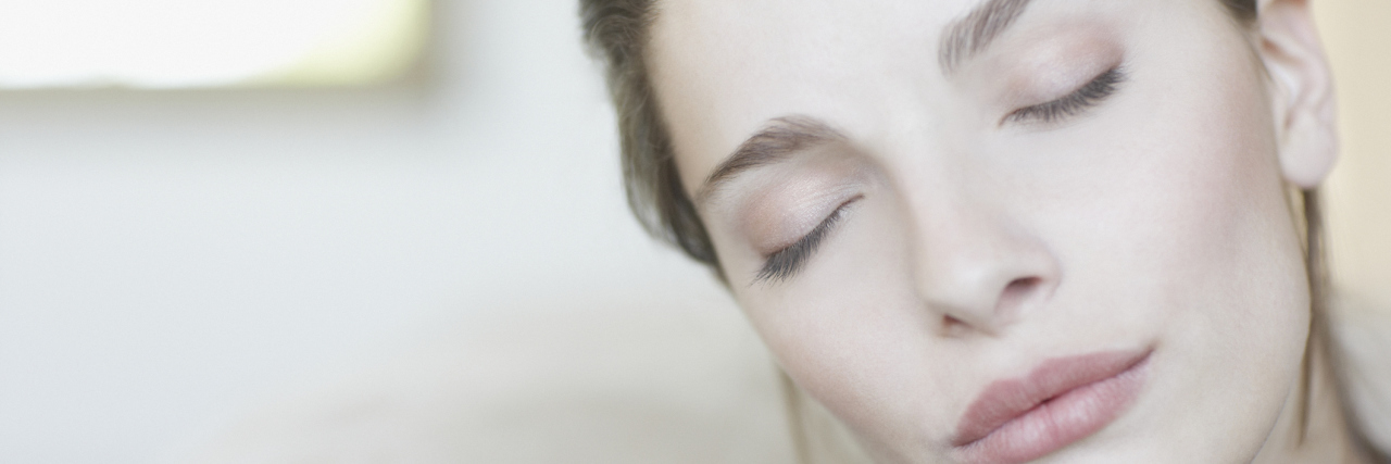 When a Nurse Asked Me How I Was Doing A woman with her eyes closed.