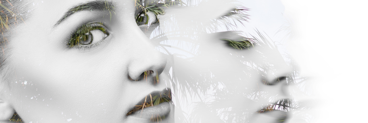 Double exposure portrait of young woman combined with photograph of branches.
