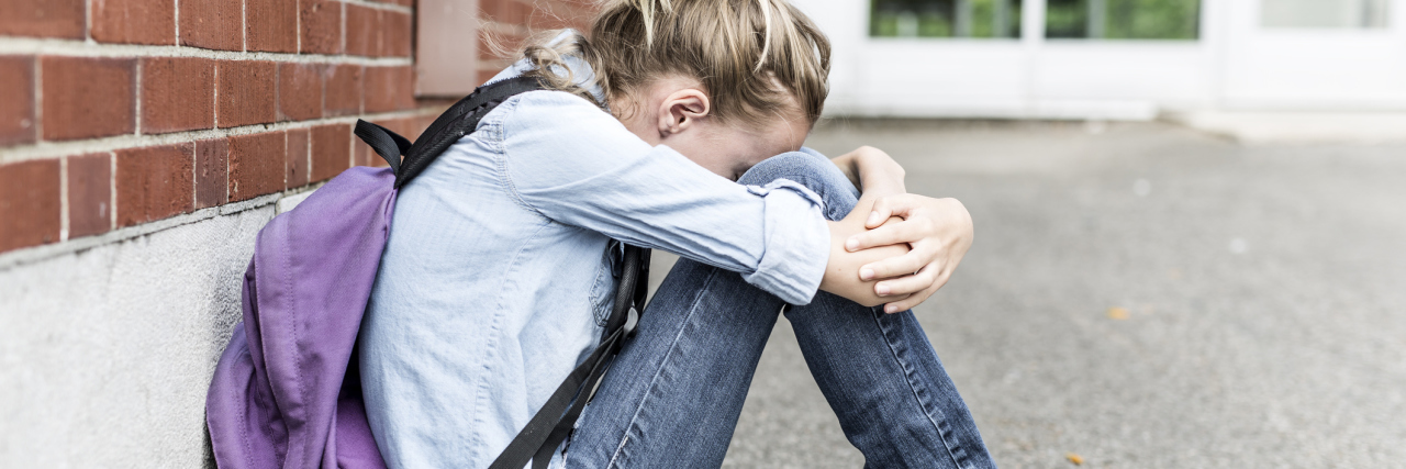 Coping With Complex PTSD as an Adult Survivor of Child Abuse young girl preteen outside school