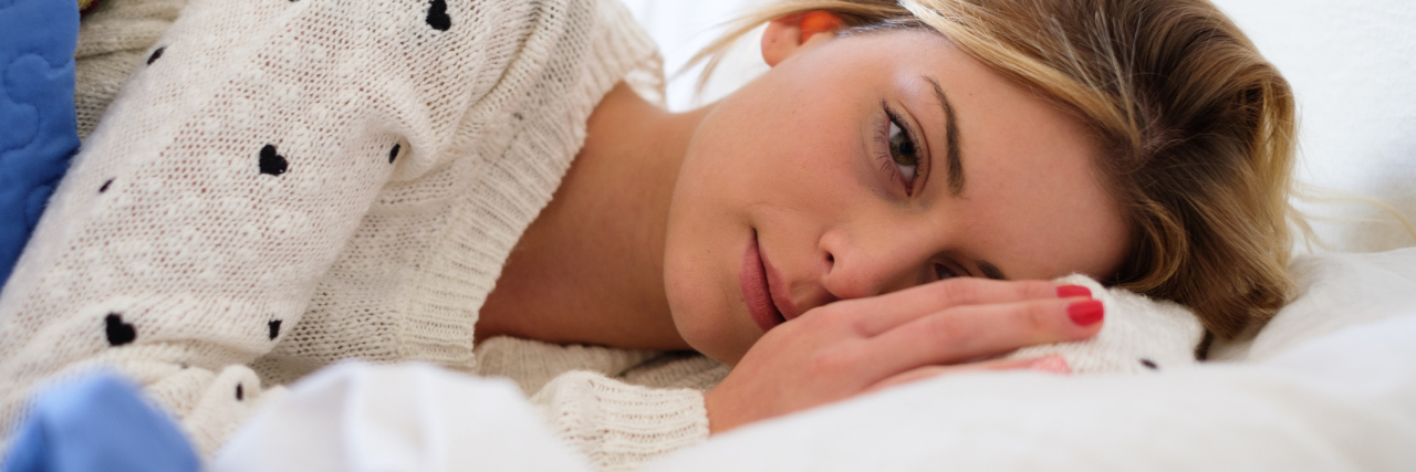 What Happened When My Passive Suicidal Thoughts Became Active Plans worried woman lying on bed thinking