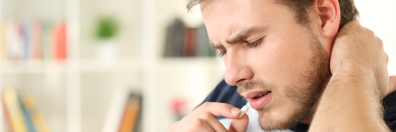 If You Want There to Be a Limit on Pain Medication A man in pain taking medication.