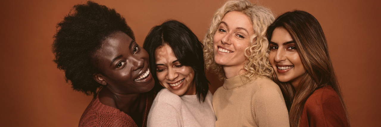 Endometriosis Is Not a Competition four women hugging each other and laughing