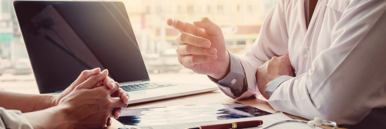 When a Doctor Gives Up on You and Can't Help With Your Migraine doctor talking with a patient in his office