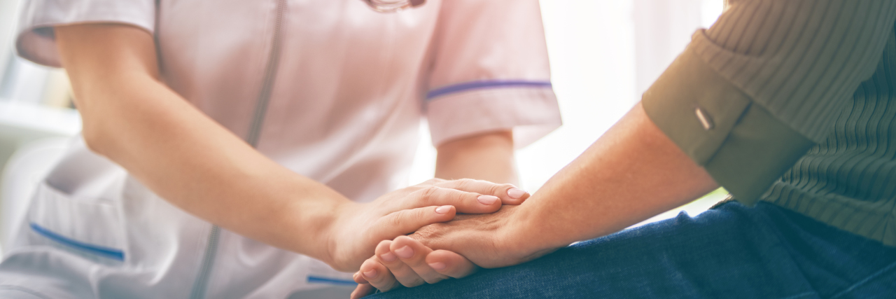 When Doctors Won't Listen to You Because of Your Rare Condition Female patient listening to a nurse in medical office.