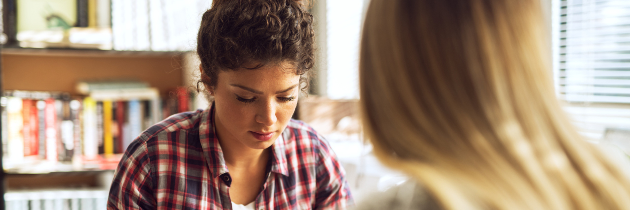 To My Chronically Ill High School Self Trying to Pick a Career Two high schoolers studying in the library.