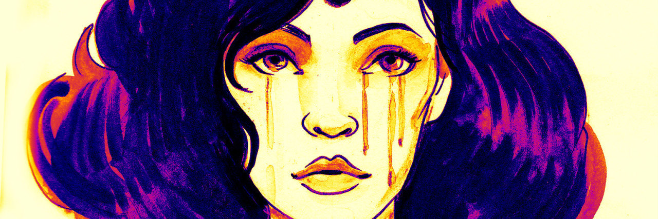 The Uncommon Panic Attack Symptom We Don't Talk About woman crying