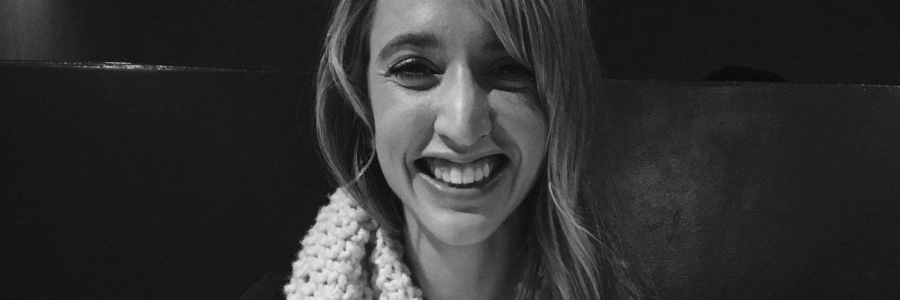 What I've Learned About Nutrition From Being Unable to Eat black and white photo of a woman sitting at a table and smiling