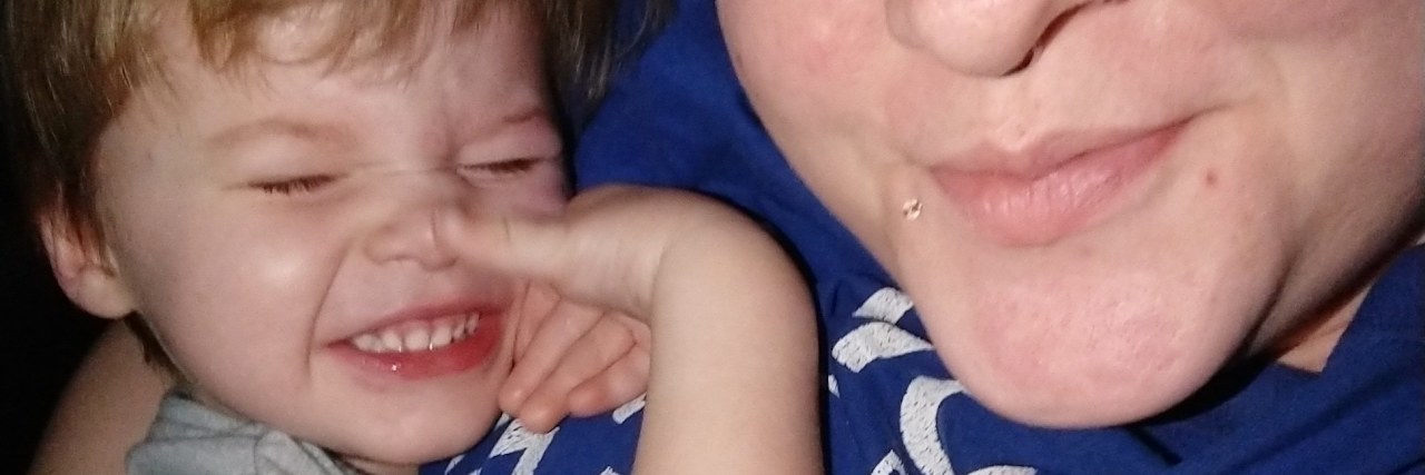 My Son Has Autism, Not a Discipline Problem Mother and toddler son taking a selfie. Little boy is cuddled close to his mom as they smile at the camera.