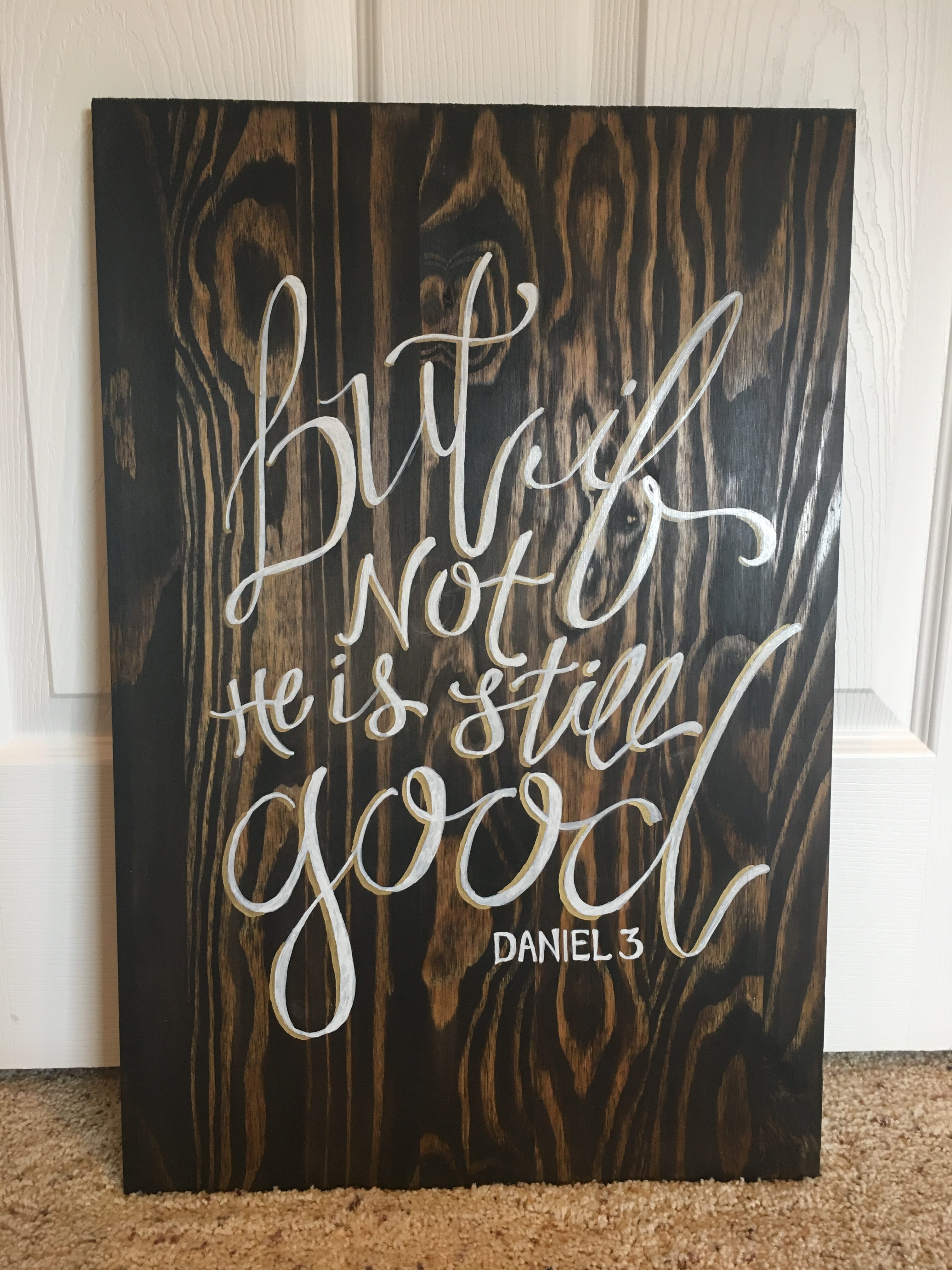 A wood board that says, "But if not He is still good. - Daniel 3"