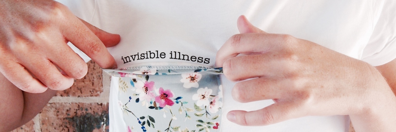 "invisible" tee with message under floral breast pocket