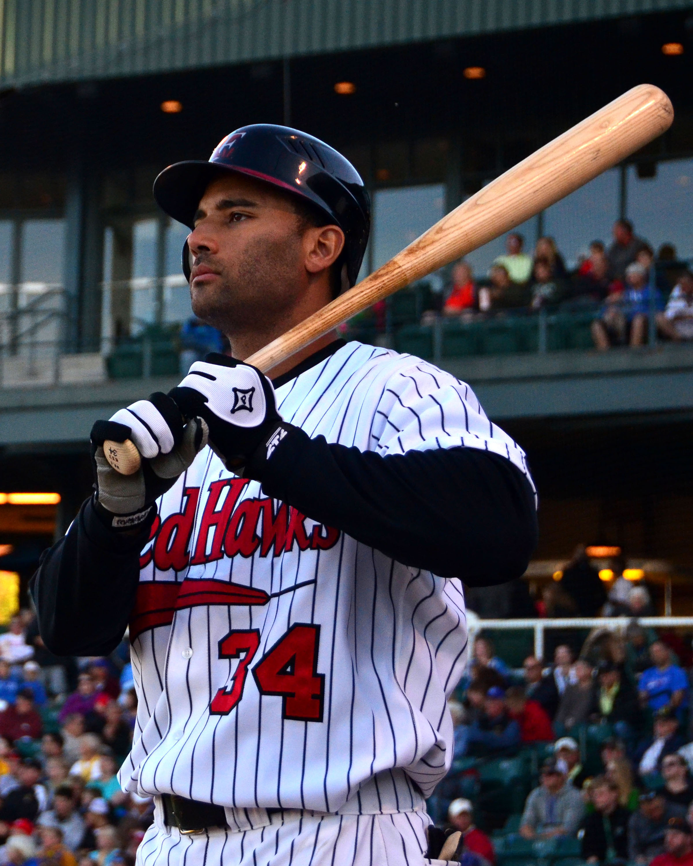 A photo of a baseball player holding a bat.