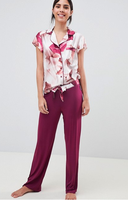 red pink and white floral short sleeved pajama top and maroon pajama pants