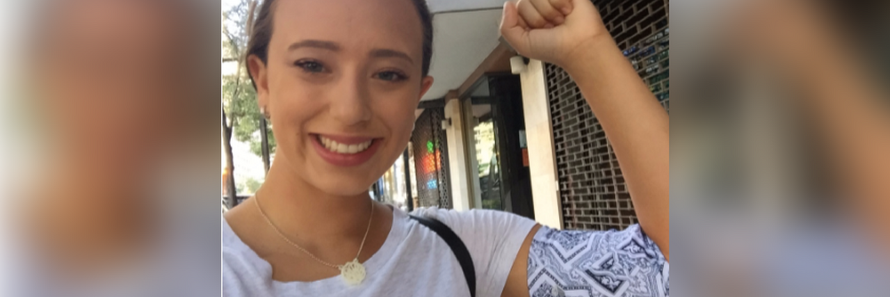 Cancelling Plans Last Minute Due to Chronic Illness woman flexing her arm and wearing a PICC line cover