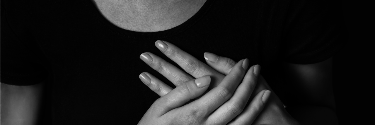 AHA Warns Breast Cancer Patients Treatment May Affect Their Hearts Woman with hands over her chest