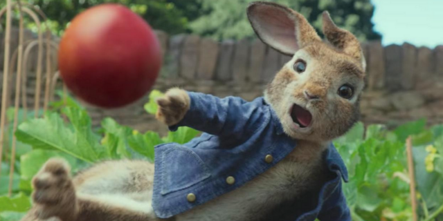 Peter Rabbit throwing a blackberry