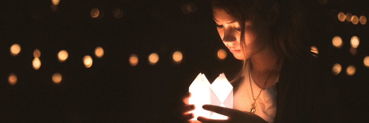 When BPD Makes You Believe You Don't Deserve Recovery woman with light