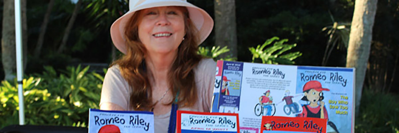 April M. Whitt with her Romeo Riley books.