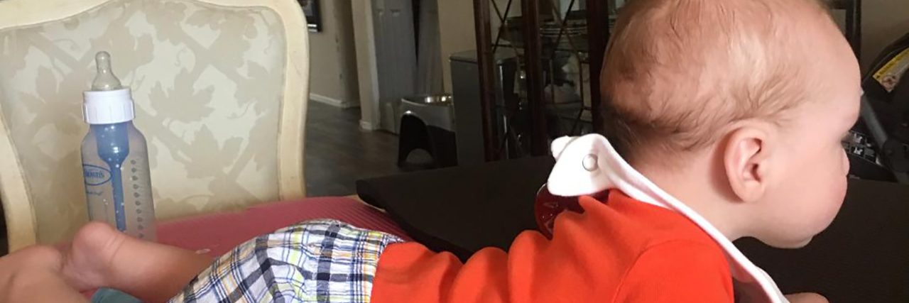 Tummy Time for My Son as a Mom With a Spinal Cord Injury Jessica's son on yoga mats on the table for tummy time.